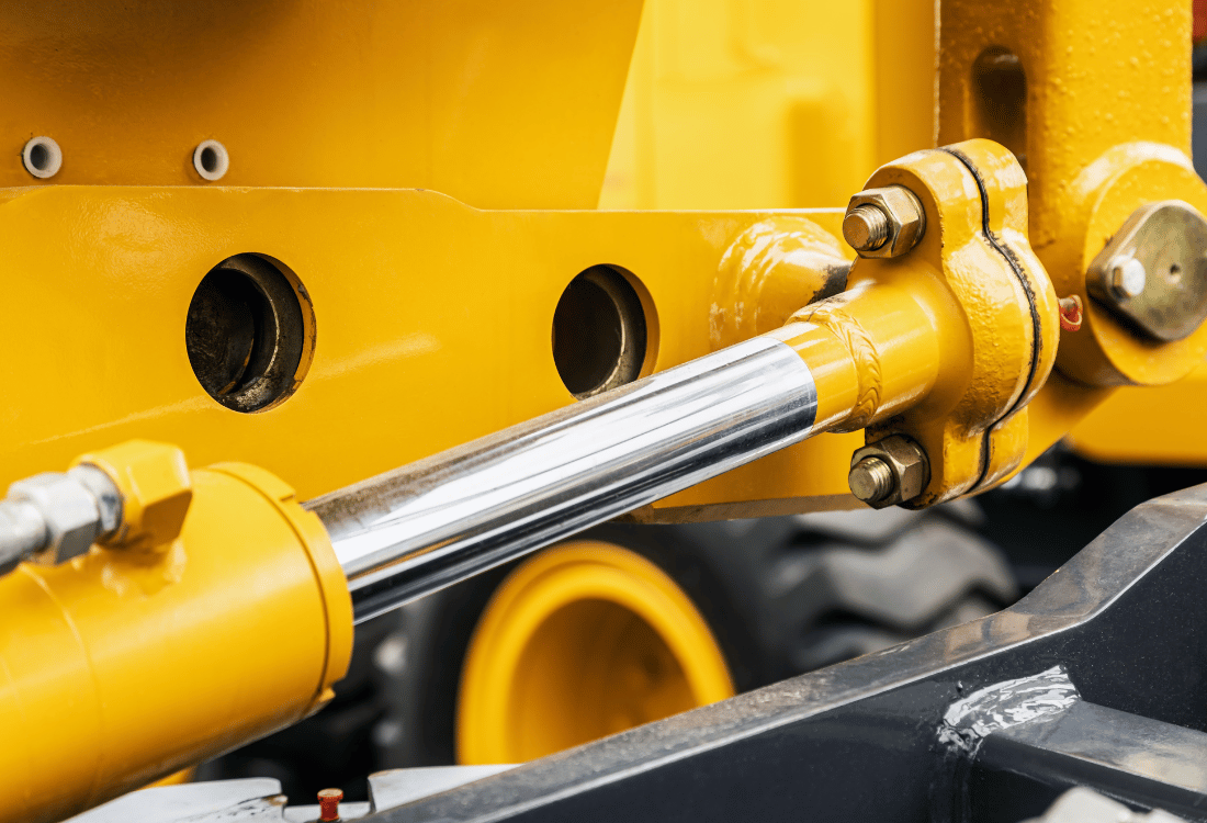 Yellow hydraulic system being used on a piece of farm equipment.